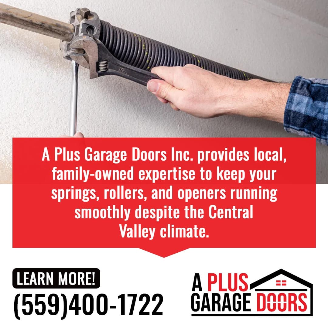 Technician tightening a garage door torsion spring with a wrench